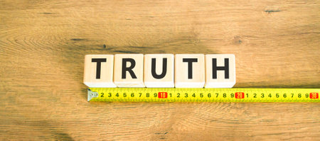 Truth symbol. Concept word Truth on beautiful wooden blocks. Beautiful wooden table wooden background. Beautiful yellow ruler. Business lifestyle truth concept. Copy space.の写真素材