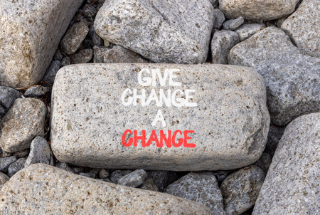 Give change a chance symbol. Concept words phrase Give change a chance on beautiful gray stone. Beautiful gray stone beach background. Business Give change a chance concept. Copy space.の写真素材