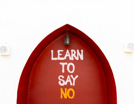 Learn to say no symbol. Concept words phrase Learn to say no on beautiful brown wall. Beautiful white wall background. Business psychological Learn to say no concept. Copy space.の写真素材