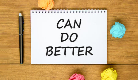 Can do better symbol. Concept words Can do better on beautiful white note. Black pen. Colored paper. Beautiful wooden background. Business and can do better concept. Copy space.の写真素材