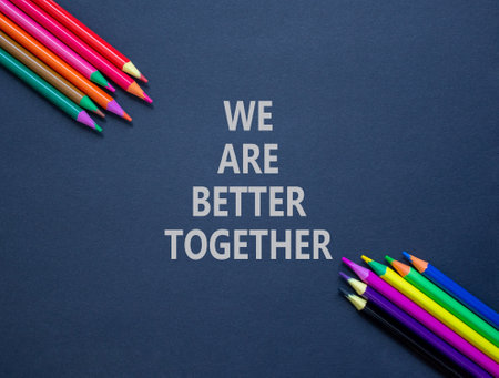 We are better together symbol. Concept words phrase We are better together on beautiful paper. Colored pencils. Beautiful black paper background. Business We are better together concept. Copy space.の写真素材