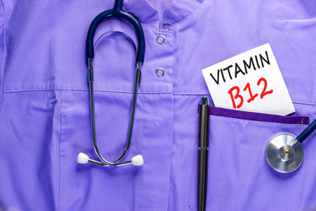 Vitamin B12 symbol. Concept words Vitamin B12 on beautiful white card. Stethoscope and pen. Beautiful medical uniform. Medical healthy lifestyle Vitamin B12 concept.の写真素材