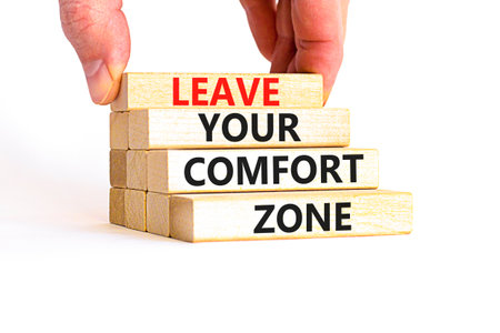 Leave your comfort zone symbol. Concept words Leave your comfort zone on beautiful wooden blocks. Beautiful white paper background. Business psychological Leave your comfort zone concept. Copy space.の写真素材