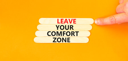 Leave your comfort zone symbol. Concept words Leave your comfort zone on beautiful wooden stick. Beautiful orange paper background. Business psychological Leave your comfort zone concept. Copy space.の写真素材