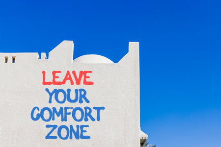 Leave your comfort zone symbol. Concept words Leave your comfort zone on beautiful white wall. Beautiful white wall background. Business psychological Leave your comfort zone concept. Copy space.の写真素材