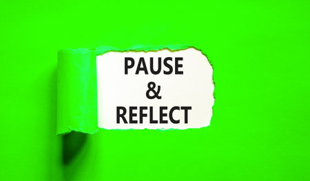 Pause and reflect symbol. Concept words Pause and reflect on beautiful white paper. Beautiful green paper background. Business motivational lifestyle pause and reflect concept. Copy space.の写真素材