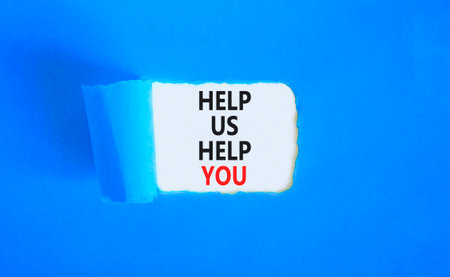 Help you symbol. Concept words phrase Help us help you on beautiful white paper. Beautiful blue paper background. Business Help you concept. Copy space.の写真素材