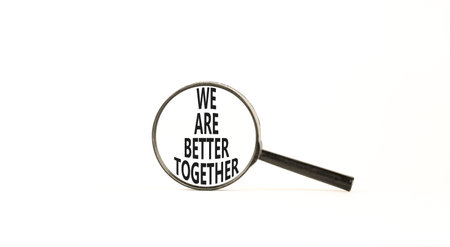 We are better together symbol. Concept words phrase We are better together on beautiful white paper. Beautiful yellow background. Business We are better together concept. Copy space.の写真素材