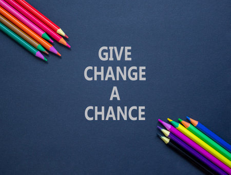 Give change a chance symbol. Concept words phrase Give change a chance on beautiful black paper. Colored pencils. Beautiful black paper background. Business Give change a chance concept. Copy space.の写真素材