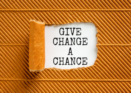 Give change a chance symbol. Concept words phrase Give change a chance on beautiful white paper. Beautiful brown paper background. Business Give change a chance concept. Copy space.の写真素材