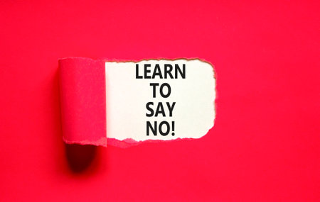 Learn to say no symbol. Concept words phrase Learn to say no on beautiful white paper. Beautiful red paper background. Business psychological Learn to say no concept. Copy space.の写真素材
