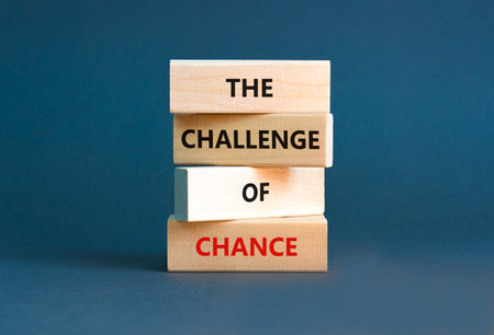 The challenge of chance symbol. Concept words phrase The challenge of chance on beautiful wooden blocks. Beautiful gray paper background. Business The challenge of chance concept. Copy space.の写真素材