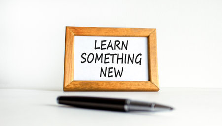Learn something new symbol. Concept words Learn something new on beautiful wooden picture frame. Beautiful white background. Business motivational lifestyle learn something new concept. Copy space.の写真素材