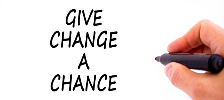 Give change a chance symbol. Concept words phrase Give change a chance on beautiful white paper. Businessman's hand. Beautiful white background. Business Give change a chance concept. Copy space.の写真素材