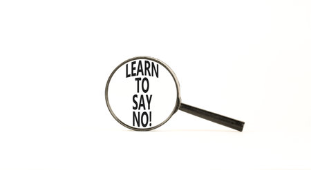 Learn to say no symbol. Concept words phrase Learn to say no in beautiful black magnifying glass. Beautiful white background. Business psychological Learn to say no concept. Copy space.の写真素材