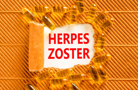 Herpes zoster symbol. Concept words Herpes zoster on beautiful white paper. Yellow pills tablets. Beautiful brown background. Medical healthy lifestyle herpes zoster concept.の写真素材