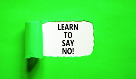 Learn to say no symbol. Concept words phrase Learn to say no on beautiful white paper. Beautiful green paper background. Business psychological Learn to say no concept. Copy space.の写真素材