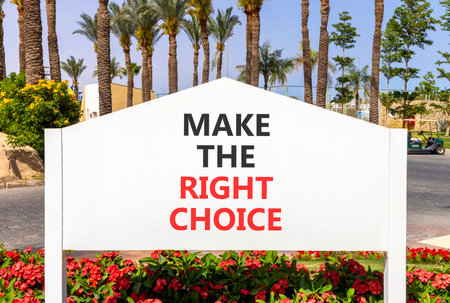 Make the right choice symbol. Concept words phrase Make the right choice on beautiful big white road sign. Beautiful palm tree blue sky background. Business Make the right choice concept. Copy space.の写真素材