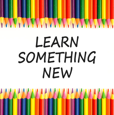 Learn something new symbol. Concept words Learn something new on beautiful white paper. Beautiful white background. Colored pencils. Business motivational learn something new concept. Copy space.の写真素材