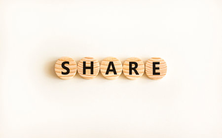 Share symbol. Concept word Share on beautiful wooden circles. Beautiful white table white background. Business lifestyle share concept. Copy space.の写真素材