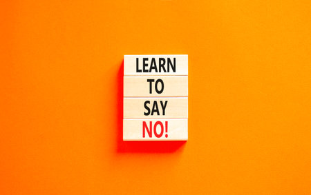 Learn to say no symbol. Concept words phrase Learn to say no on beautiful wooden blocks. Beautiful orange paper background. Business psychological Learn to say no concept. Copy space.の写真素材