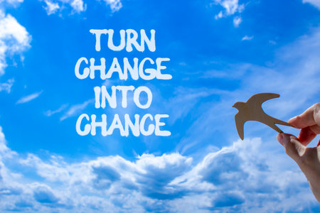 Turn change into chance symbol. Concept words phrase Turn change into chance on beautiful sky....