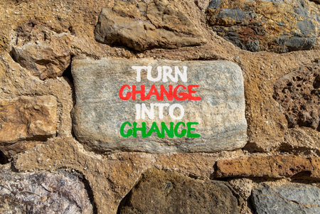 Turn change into chance symbol. Concept words phrase Turn change into chance on beautiful gray stone wall. Beautiful stone wall background. Business Turn change into chance concept. Copy space.の写真素材
