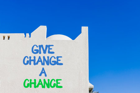 Give change a chance symbol. Concept words phrase Give change a chance on beautiful white wall. Beautiful white wall and blue sky background. Business Give change a chance concept. Copy space.の写真素材