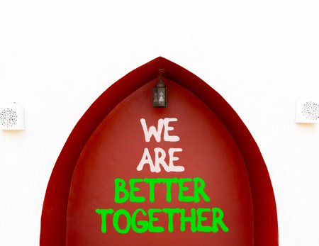 We are better together symbol. Concept words phrase We are better together on beautiful brown wall. Beautiful white wall background. Business We are better together concept. Copy space.の写真素材