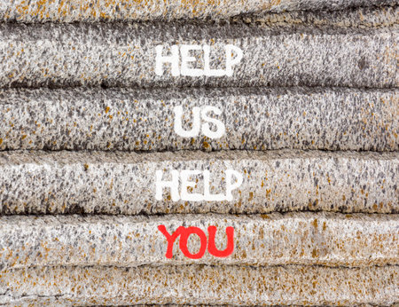 Help you symbol. Concept words phrase Help us help you on beautiful gray stone wall. Beautiful stone wall background. Business Help you concept. Copy space.の写真素材