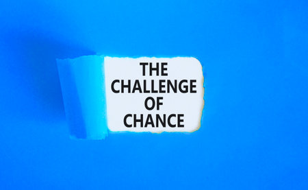 The challenge of chance symbol. Concept words phrase The challenge of chance on beautiful white paper. Beautiful blue paper background. Business The challenge of chance concept. Copy space.の写真素材