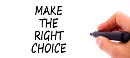 Make the right choice symbol. Concept words phrase Make the right choice on beautiful white paper. Businessman's hand. Beautiful white background. Business Make the right choice concept. Copy space.の写真素材