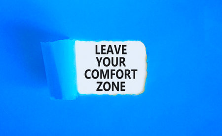 Leave your comfort zone symbol. Concept words Leave your comfort zone on beautiful white paper. Beautiful blue paper background. Business psychological Leave your comfort zone concept. Copy space.の写真素材