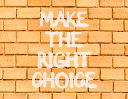 Make the right choice symbol. Concept words phrase Make the right choice on beautiful brown brick wall. Beautiful brown brick wall background. Business Make the right choice concept. Copy space.の写真素材