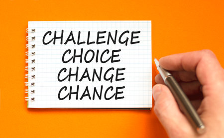 Challenge choice change chance symbol. Concept words Challenge choice change chance on beautiful white note. Beautiful orange background. Business Challenge choice change chance concept. Copy space.の写真素材