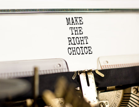 Make the right choice symbol. Concept words phrase Make the right choice typed on beautiful retro old typewriter. Beautiful white background. Business Make the right choice concept. Copy space.の写真素材