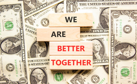 We are better together symbol. Concept words phrase We are better together on beautiful blocks. Dollar bills. Beautiful dollar bills background. Business We are better together concept. Copy spaceの写真素材