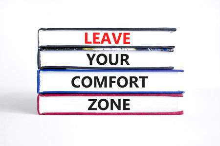 Leave your comfort zone symbol. Concept words Leave your comfort zone on beautiful books. Beautiful white paper background. Business psychological Leave your comfort zone concept. Copy space.の写真素材