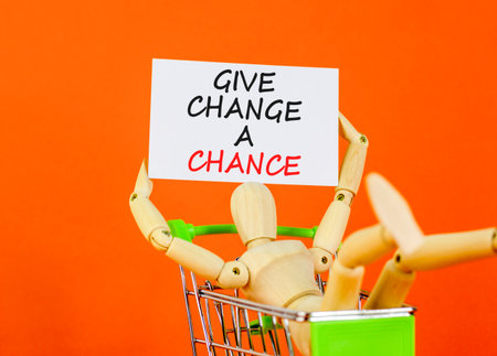Give change a chance symbol. Concept words phrase Give change a chance on beautiful white card. Businessman hand. Beautiful white paper background. Business Give change a chance concept. Copy space.の写真素材