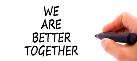 We are better together symbol. Concept words phrase We are better together on beautiful white paper. Businessman's hand. Beautiful white background Business We are better together concept Copy spaceの写真素材
