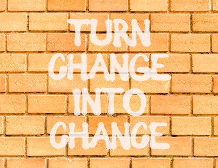 Turn change into chance symbol. Concept words phrase Turn change into chance on beautiful brown brick wall. Beautiful brown brick wall background. Business Turn change into chance concept. Copy space.の写真素材