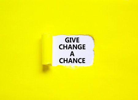 Give change a chance symbol. Concept words phrase Give change a chance on beautiful white paper. Beautiful yellow paper background. Business motivational Give change a chance concept. Copy space.の写真素材
