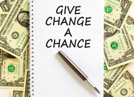 Give change a chance symbol. Concept words phrase Give change a chance on beautiful white note. Dollar bills. Beautiful dollar bills background. Business Give change a chance concept. Copy space.の写真素材