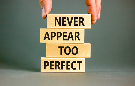 Never appear too perfect symbol. Concept words Never appear too perfect on beautiful wooden blocks....