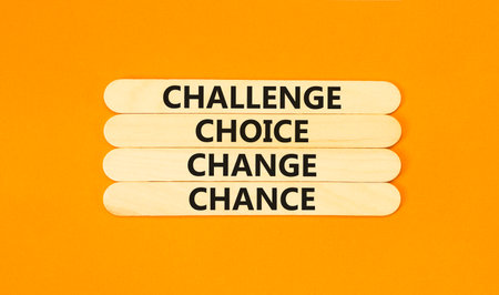 Challenge choice change chance symbol. Concept words Challenge choice change chance on beautiful wooden stick. Beautiful orange background. Business Challenge choice change chance concept. Copy space.の写真素材