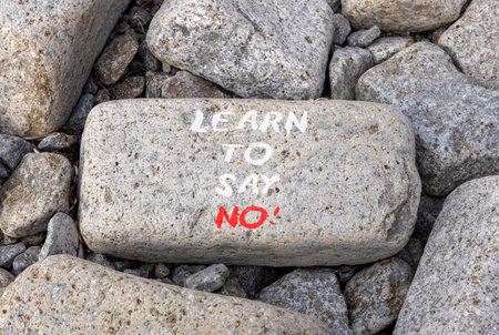Learn to say no symbol. Concept words phrase Learn to say no on beautiful gray stone. Beautiful gray stone beach background. Business psychological Learn to say no concept. Copy space.の写真素材