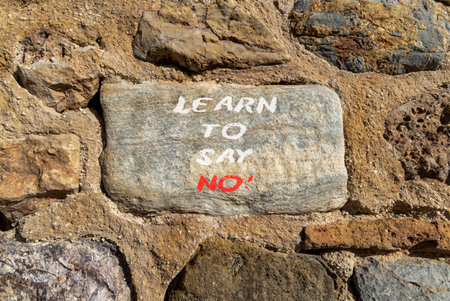 Learn to say no symbol. Concept words phrase Learn to say no on beautiful gray stone wall. Beautiful stone wall background. Business psychological Learn to say no concept. Copy space.の写真素材