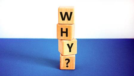 Why question symbol. Concept word Why question on beautiful wooden blocks. Beautiful white and blue background. Business, lifestyle, support and why question concept. Copy space.の写真素材