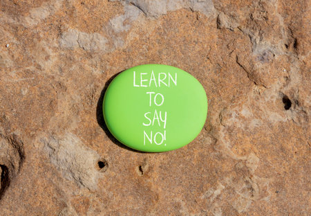 Learn to say no symbol. Concept words phrase Learn to say no on beautiful green stone. Beautiful brown stone beach background. Business psychological Learn to say no concept. Copy space.の写真素材