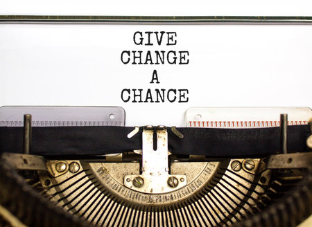 Give change a chance symbol. Concept words phrase Give change a chance typed on beautiful retro old typewriter. Beautiful white background. Business Give change a chance concept. Copy space.の写真素材